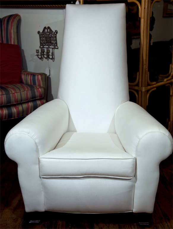 Unusual art chair with high back and rolled arm. Recently recovered in white muslin. Mahoganu legs