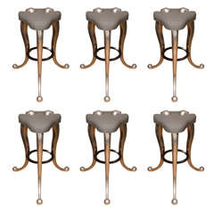 Futuristic metal three leg bar stool with upholstered seat