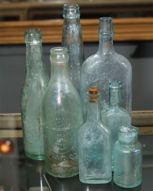 Group of Seven Aqua Bottles In Distressed Condition In Seattle, WA
