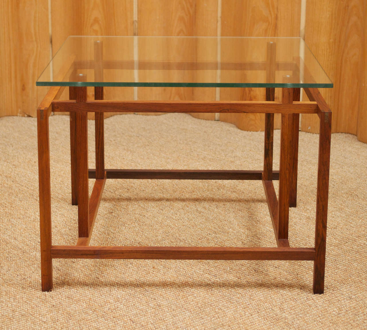 Pair of rosewood and glass side tables designed by Henning Norgaard for Komfort.