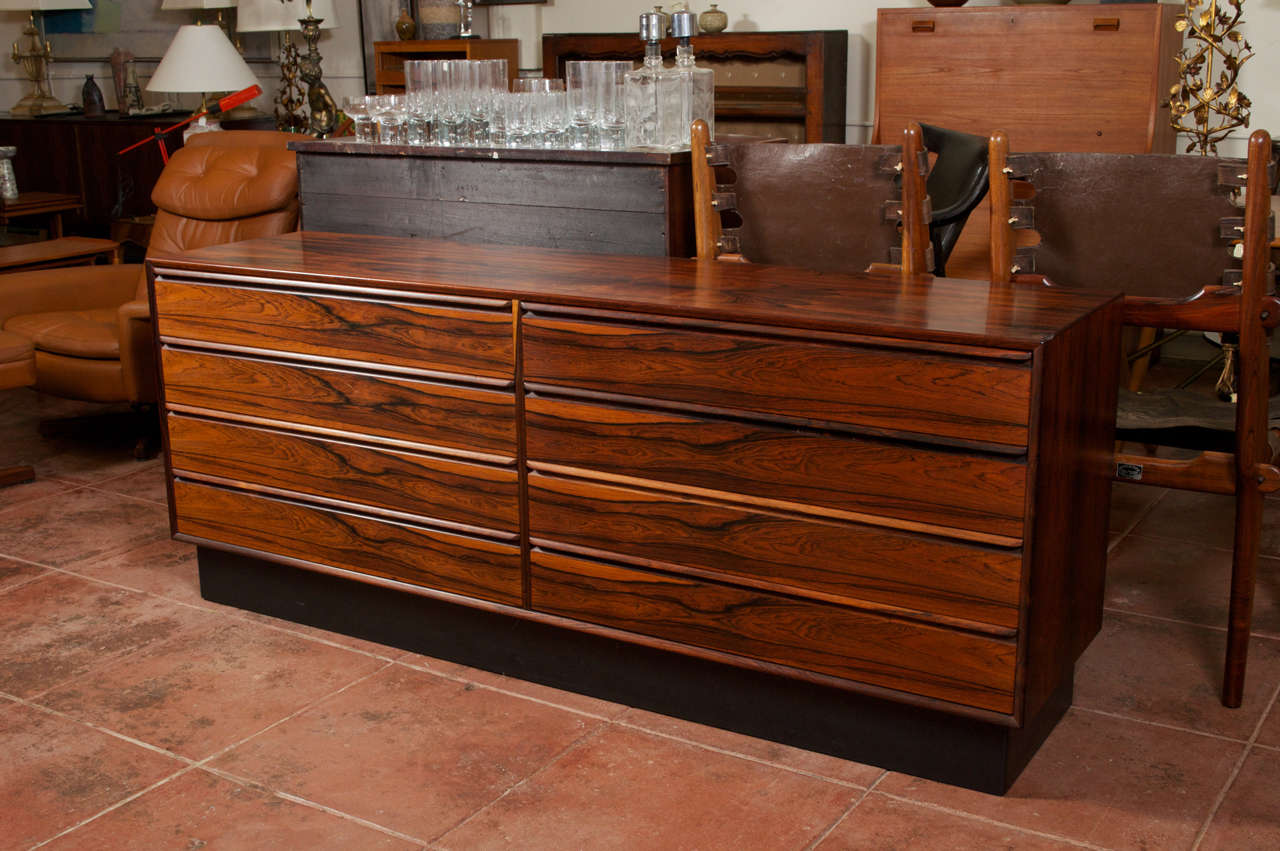 Vintage eight drawer dresser from Norway, by Westnofa. The top two drawers have two dividers, with the two next ones down have one divider each. Dresser has a black pedestal base, and is also finished on it's back side.

***Located at our Lombard