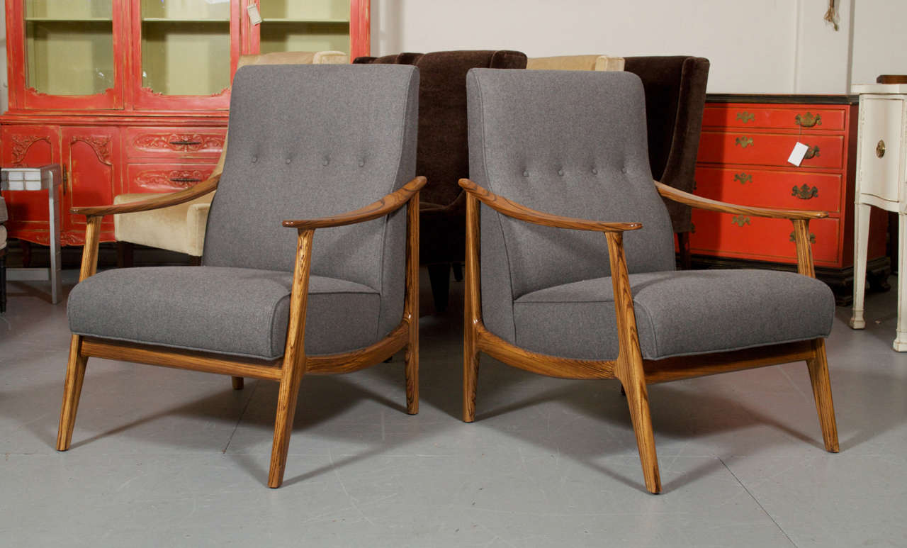 A pair of custom lounge chairs, with Zebra wood frames and new Grey Wool upholstery.  Their simple clean lines, giving you a nice vintage Danish Scandinavian modern look. These were refinished and the upholstery/cushions was reworked to update it's