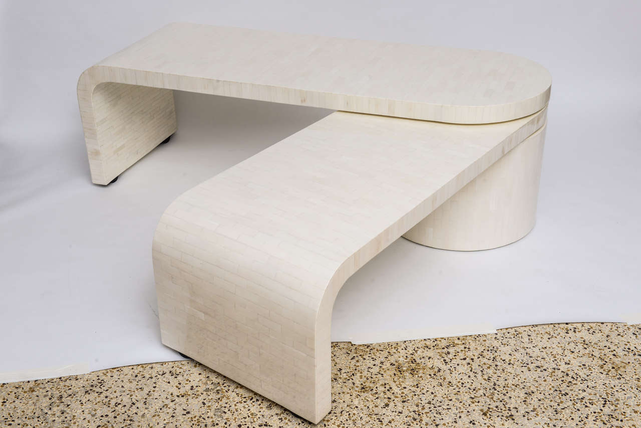 Perfectly restored 70's coffee table in tessellated bone, has two tiers that scissor out from a center base from 5 feet to nearly 8 feet in length. Wonderful adaptability, practicality... and just plain fabulosity! (We think it would make a great