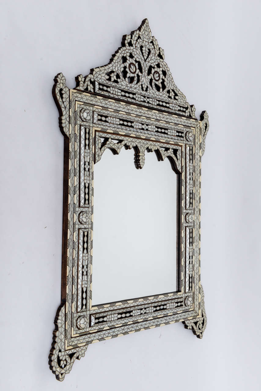 Vintage Syrian mirror with intricate mother-of-pearl and bone inlays. All our favorite bleached tones of white, cream, and palest grey!