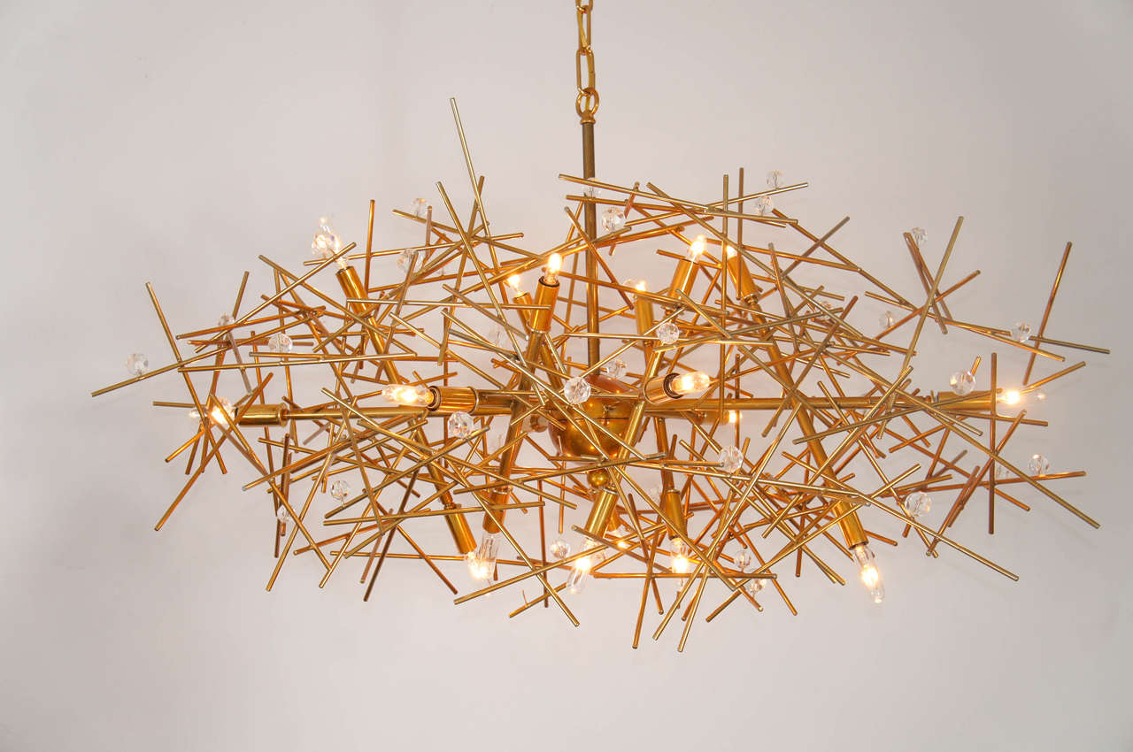 The measurements, are for the body of the chandelier, not including the main stem, and chain. Those measurement are adjustable. In fact sence they are custom, all measurement can be adjusted.
A powder-coated [Flaming Gold] steel eighteen-light