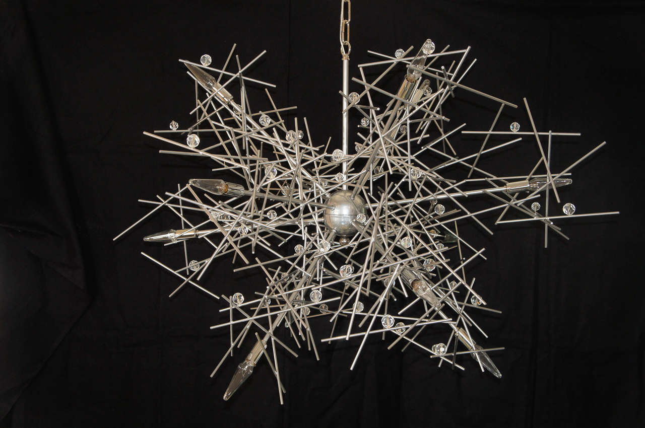 The measurements, are for the body of the chandelier, not including the main stem, and chain. Those measurement are adjustable. In fact since they are custom, all measurement can be adjusted.
A powder-coated [Super Chrome] steel chandelier with
