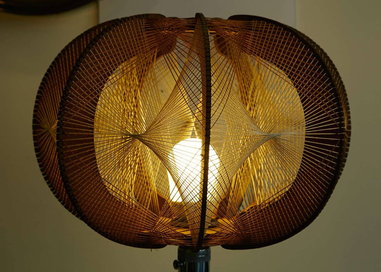 Floor lamp with Scandinavian shade made of stretched threads standing on a telescopic tripod base. This lamp can be used in lamp as shown in the pictures or as table lamp base once fully folded. Electrical wiring to the European standard.