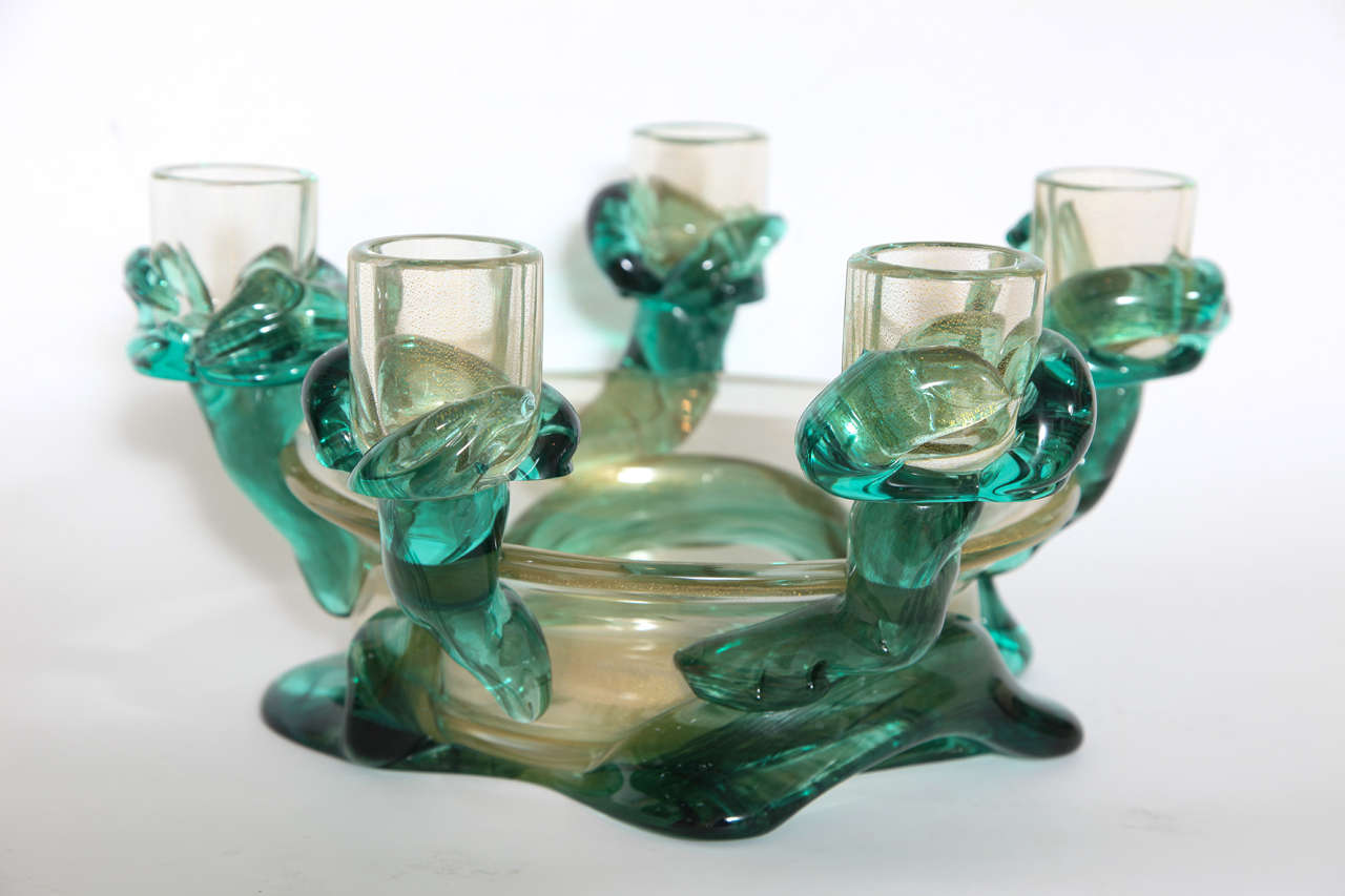 A wonderful free-form centrepiece glass bowl with gold flecks and five twisted green glass candleholders. Signed Seguso underside.