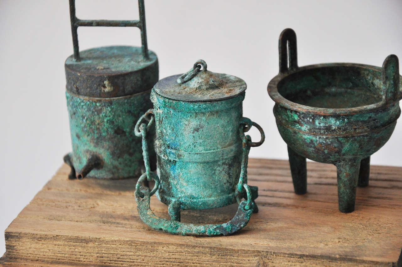 Collection of 20th Century Chinese Bronze Miniatures in a Weathered Wood/Acrylic 3