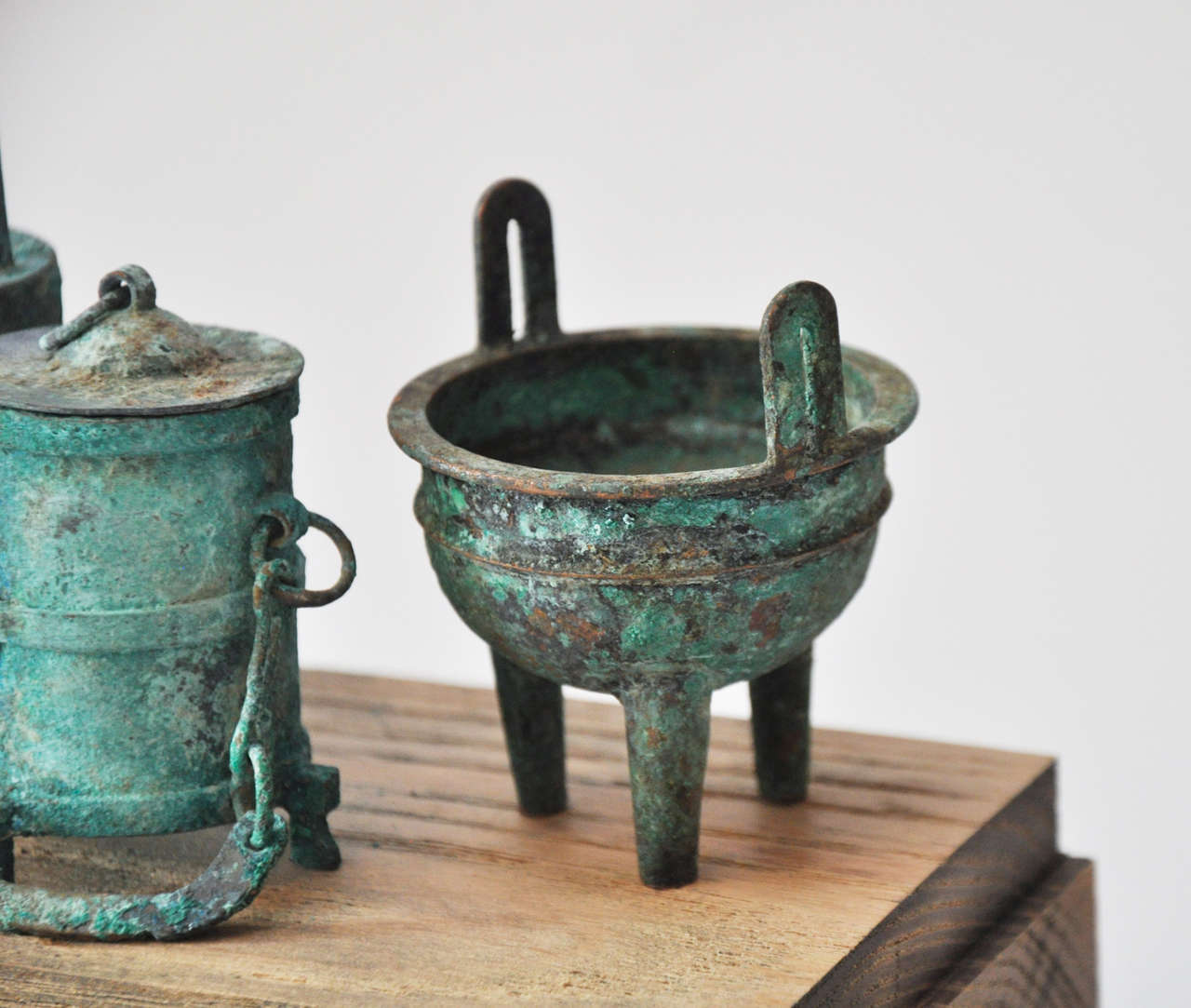 Collection of 20th Century Chinese Bronze Miniatures in a Weathered Wood/Acrylic 4