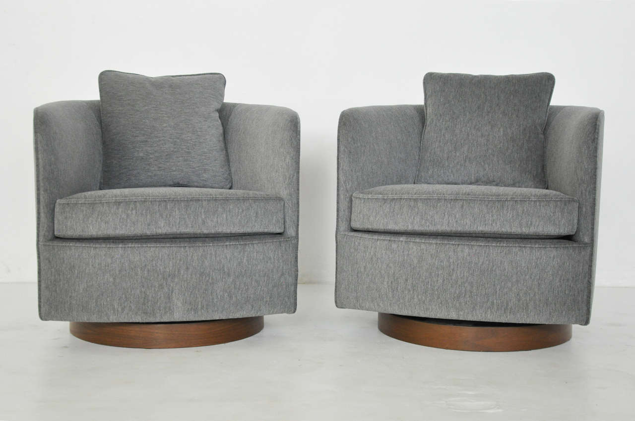 Lounge chairs by Milo Baughman. Fully restored and reupholstered in mohair. Chairs rock and swivel.