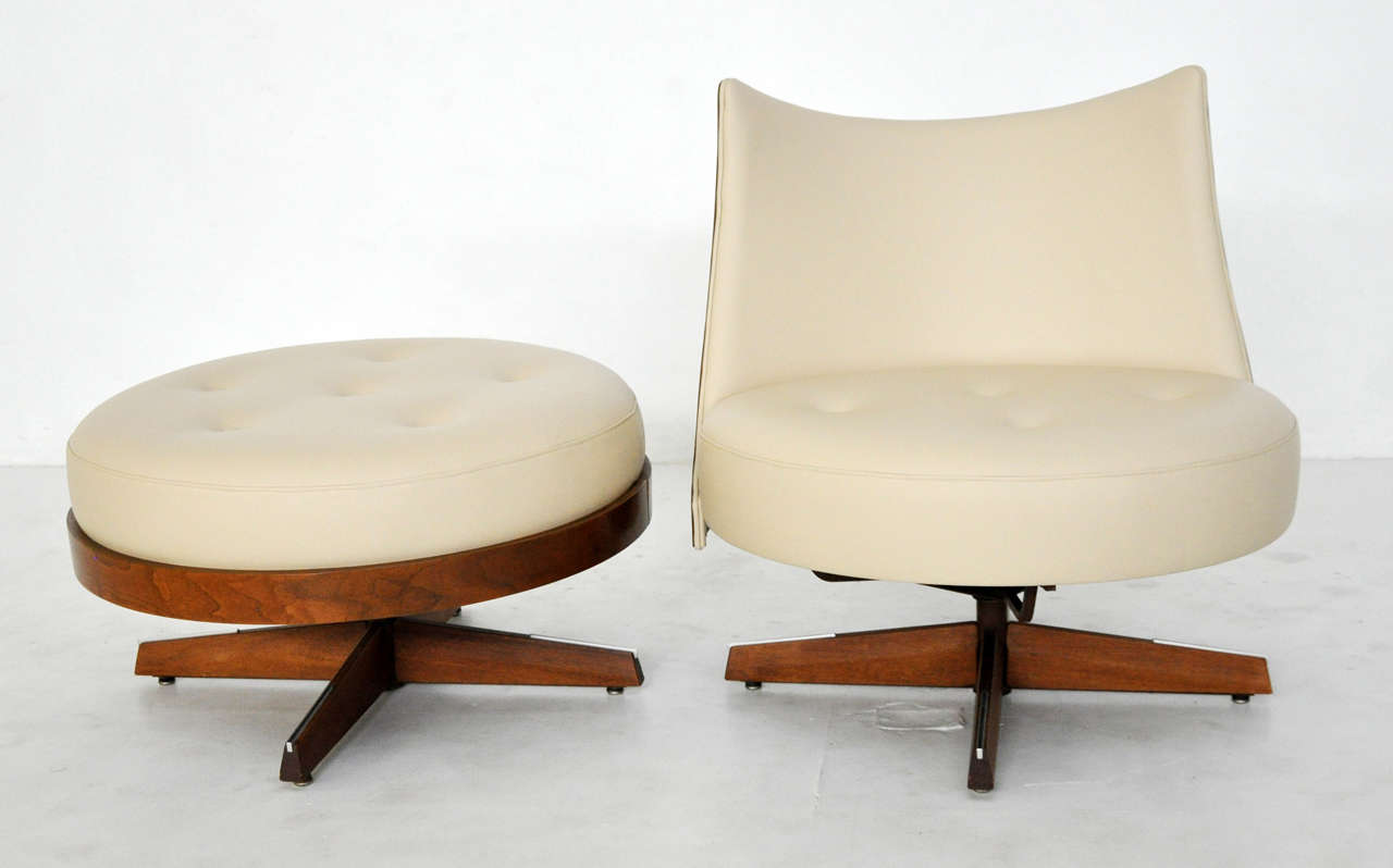 Plycraft swivel lounge chair with swivel ottoman. Fully restored walnut frame. newly upholstered in leather.