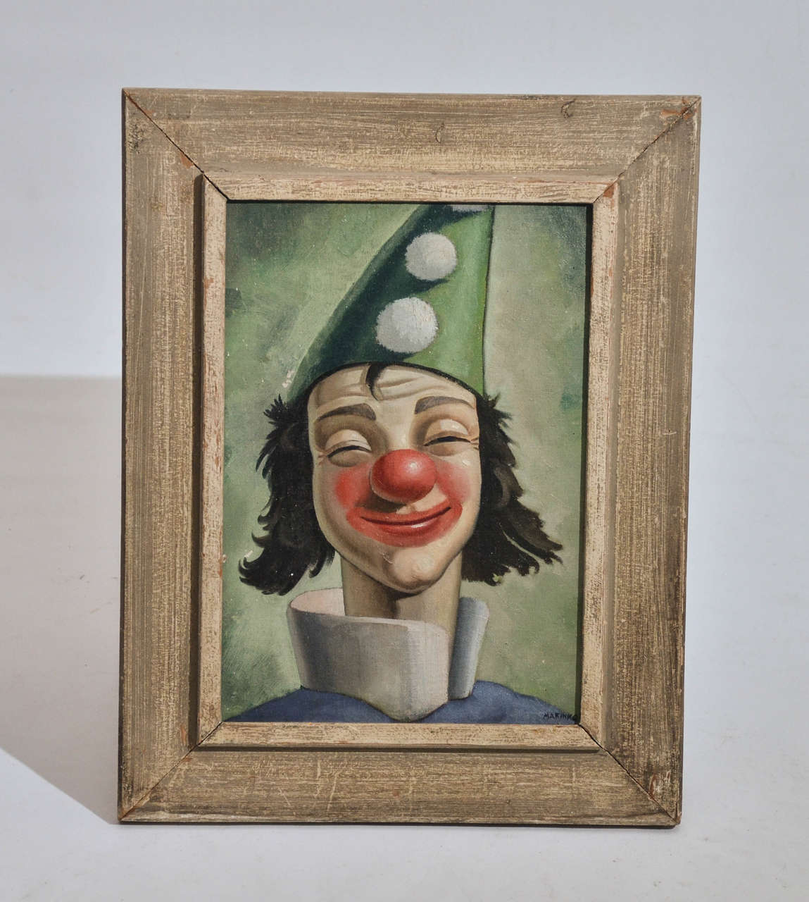 1950s clown painting in original white washed frame.