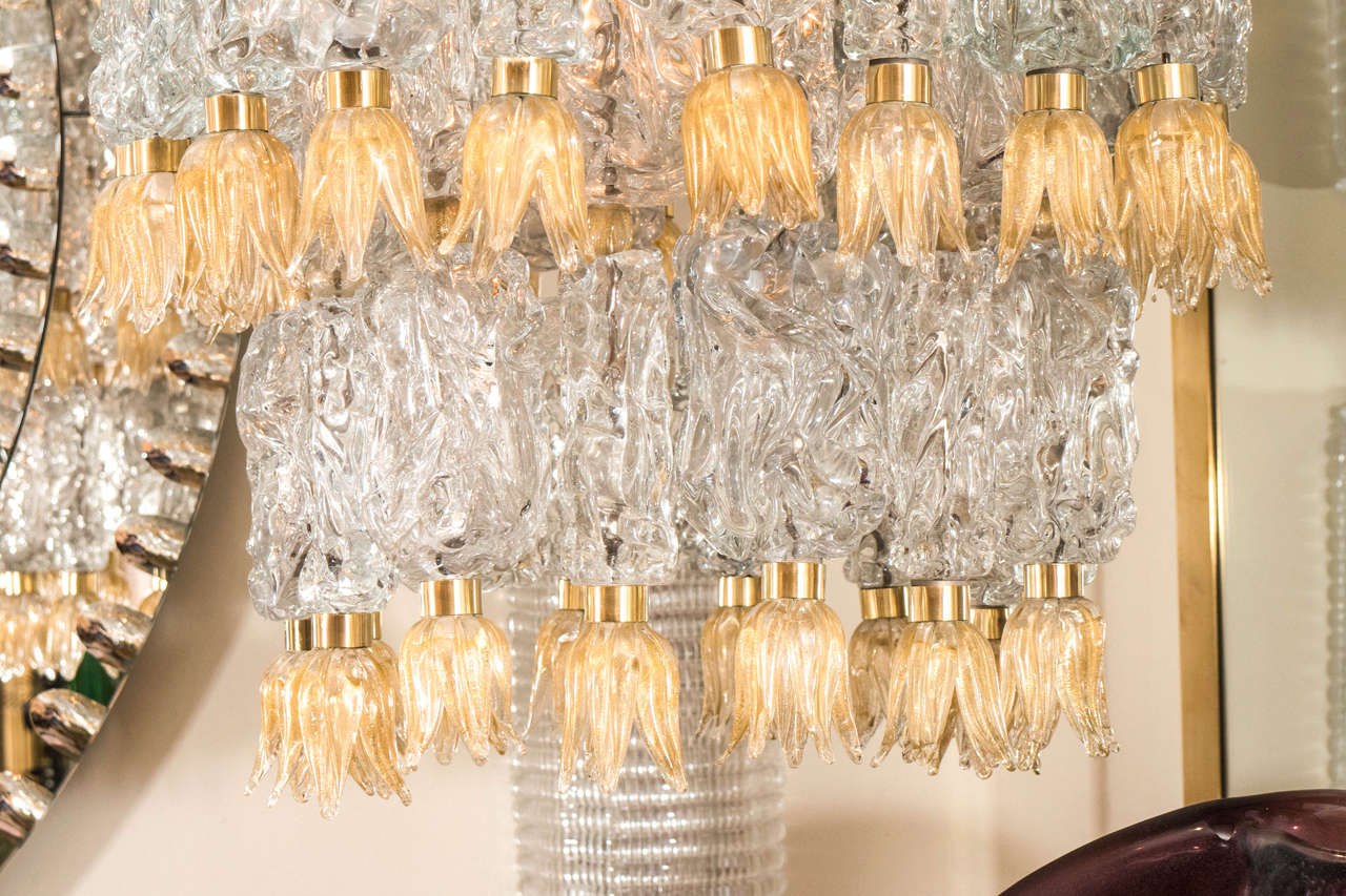 Mid-Century Modern Tiered chandeliers composed of textured glass elements