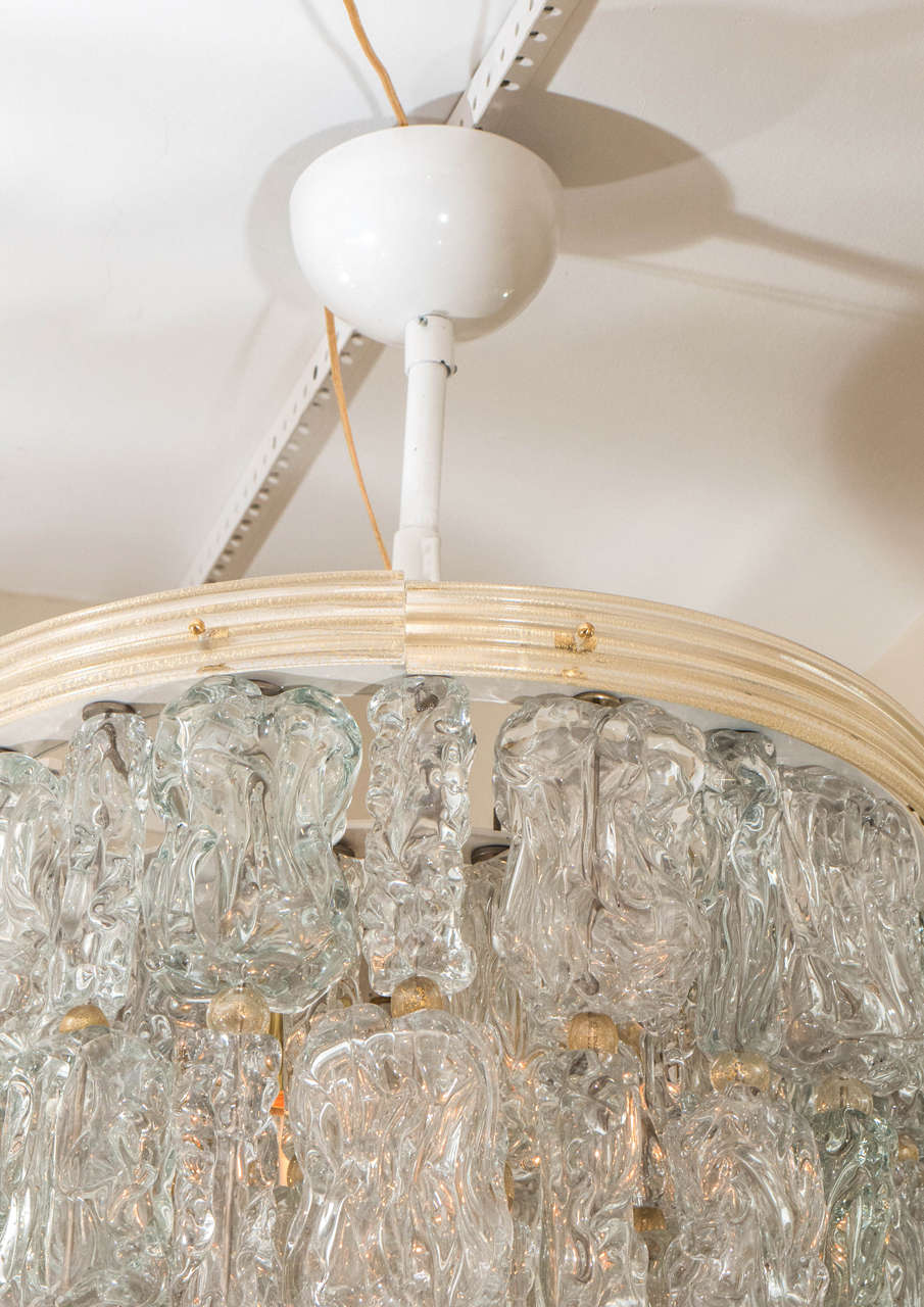 Tiered chandeliers composed of textured glass elements In Good Condition In New York, NY