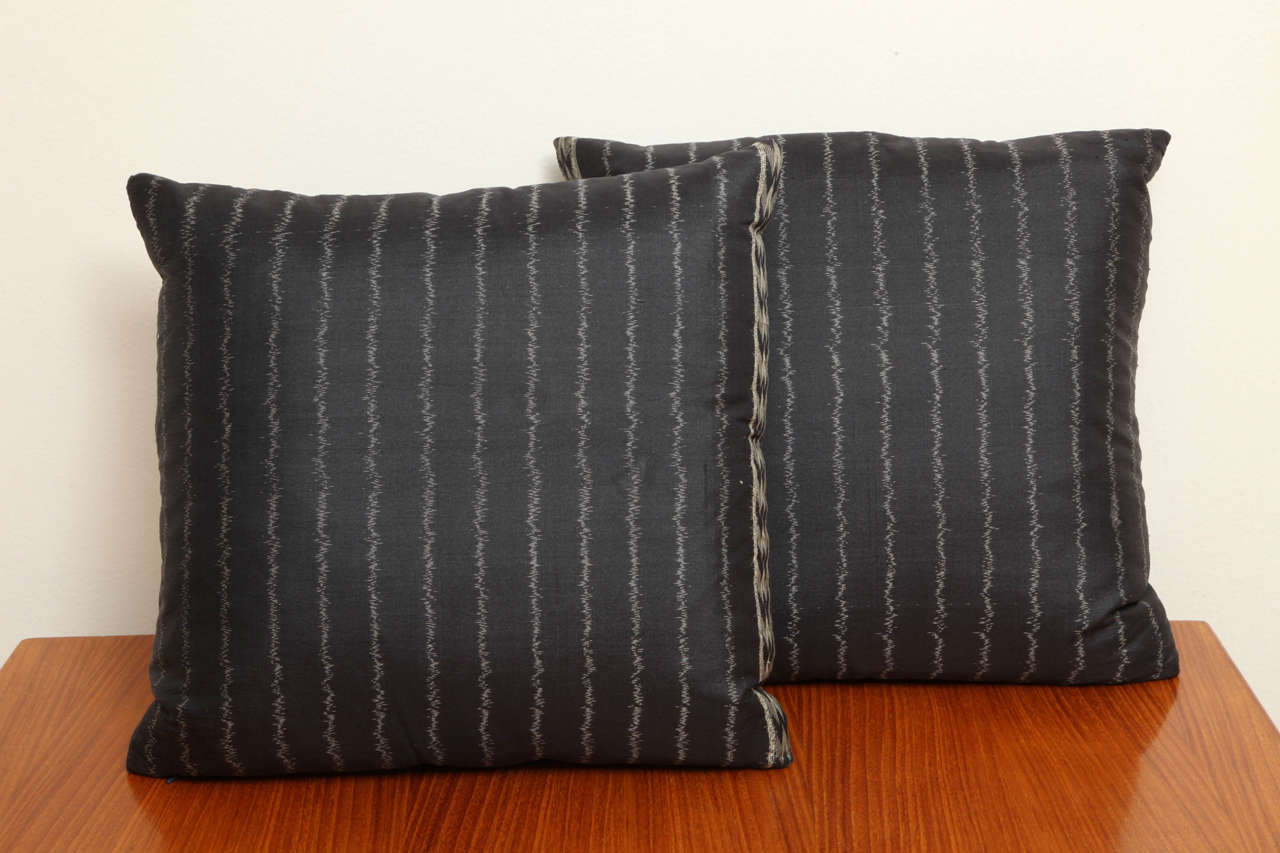 Two handwoven silk pillows from Thailand.