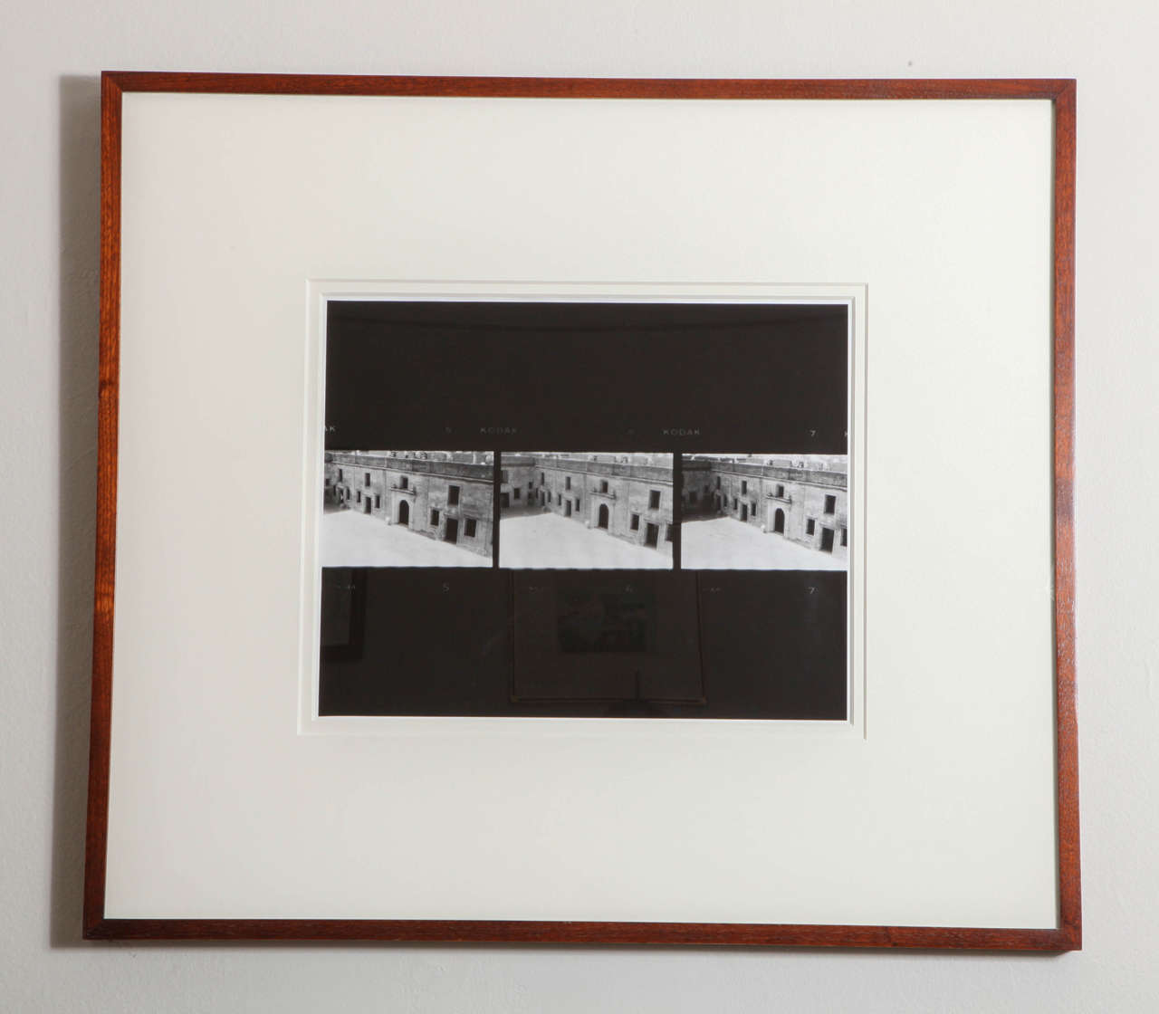 Thomas League, American photographer. Two black and white prints in custom wood frames. Can be sold separately or as a pair.