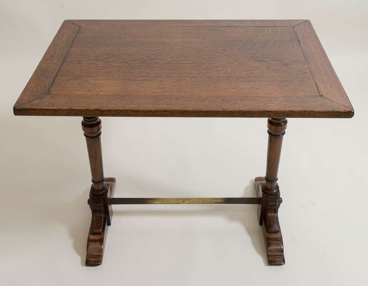 Late 19th c. English oak library /reading table of good scale. Good trestle design top resting on strong sled feet. Brass stretcher foot rest. Very sturdy. Circa 1890.