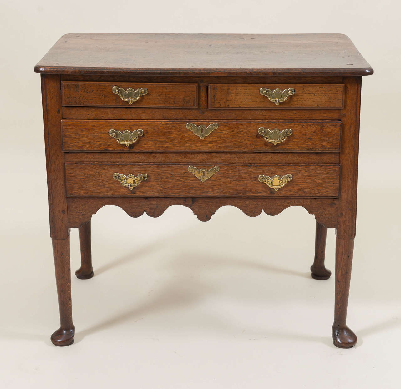18th century Georgian Lowboy chest fitted with four drawers. Good proportions to the small-scale with modified cabriole legs and pad feet. Old hardware with good details, circa 1760.