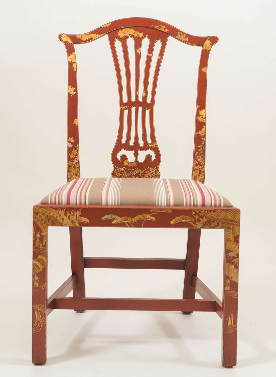 Set of ten Georgian style Japanned side chairs. Japanned in a chinoiserie manner with red lacquer and gilt design. Custom striped seat fabric by Ralph Lauren. Created by Richard Garett Atelier, circa 1960-1970.