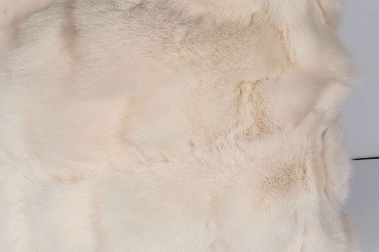 White fox pillow with white leather backing. Beautifully crafted with genuine fox fur, color matching leather backing and zipper. Made to order.