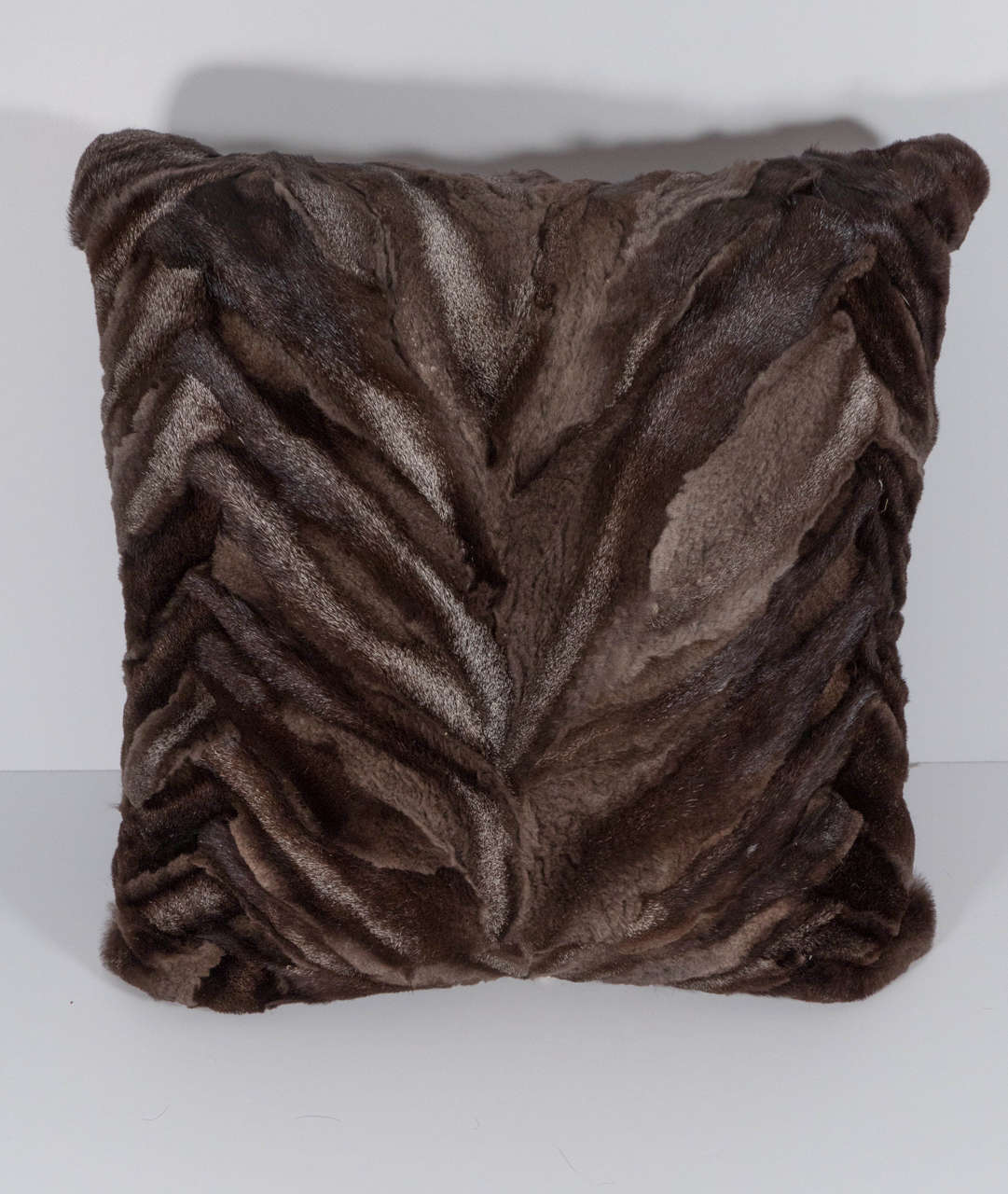 Beautiful over dyed brown, silver fox pillow with chocolate brown leather back.