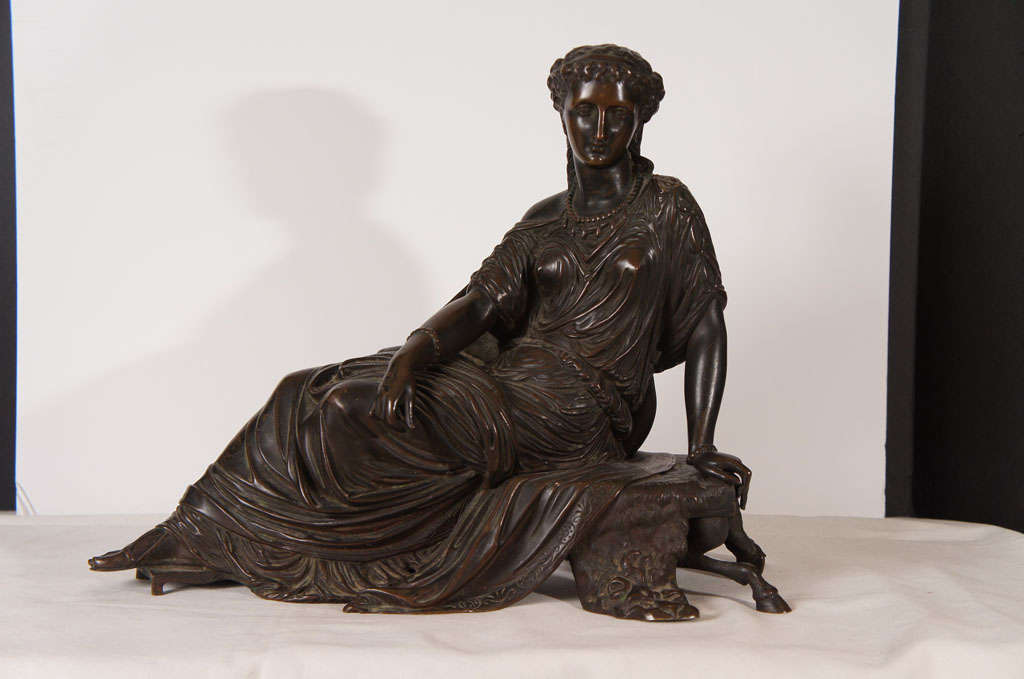 This finely cast bronze shows great attention to detail. The seated figure is cast in a number of sections giving a level of natural grace only found in the finest works. The rest of the bronze is also cast in a number of sections creating a
