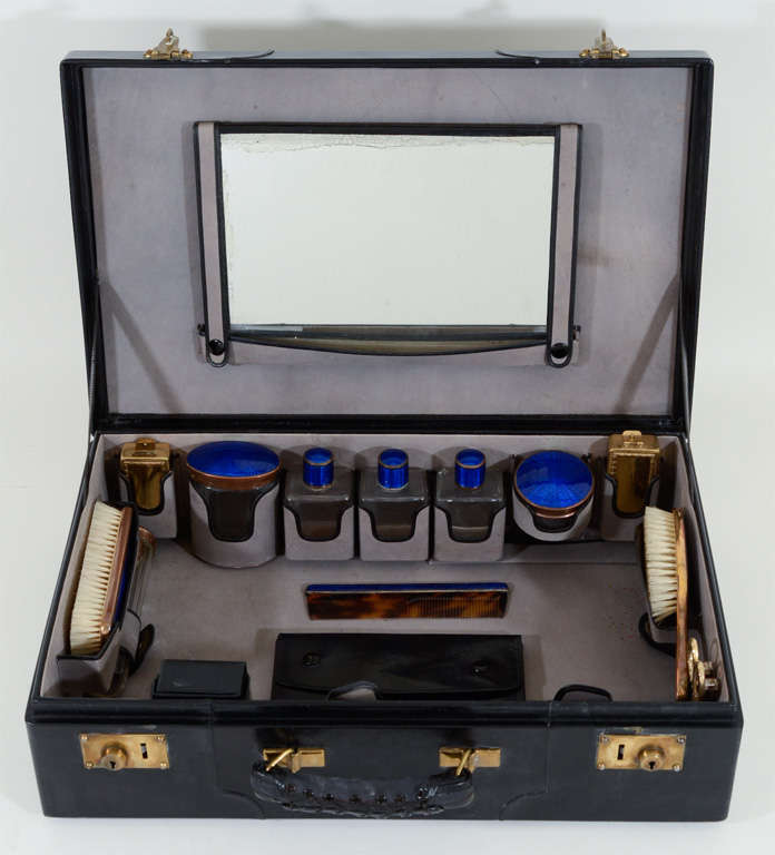 Vintage Gentleman's Black Leather Dressing Case in Mint Condition Fitted with Engine-Turned, Blue Guilloche Enamel Lidded Jars, Bottles, Hair Brush, Clothes Brush, and Comb.  Also includes a Four-Piece Ivory Handled Manicure Set, Leather Cuff-Link