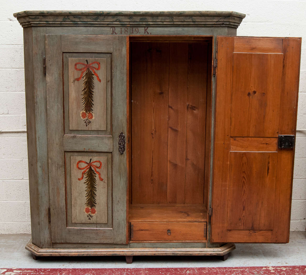 An outstanding example of early nineteenth century painted furniture, this armoire was almost certainly given as a wedding gift to 
