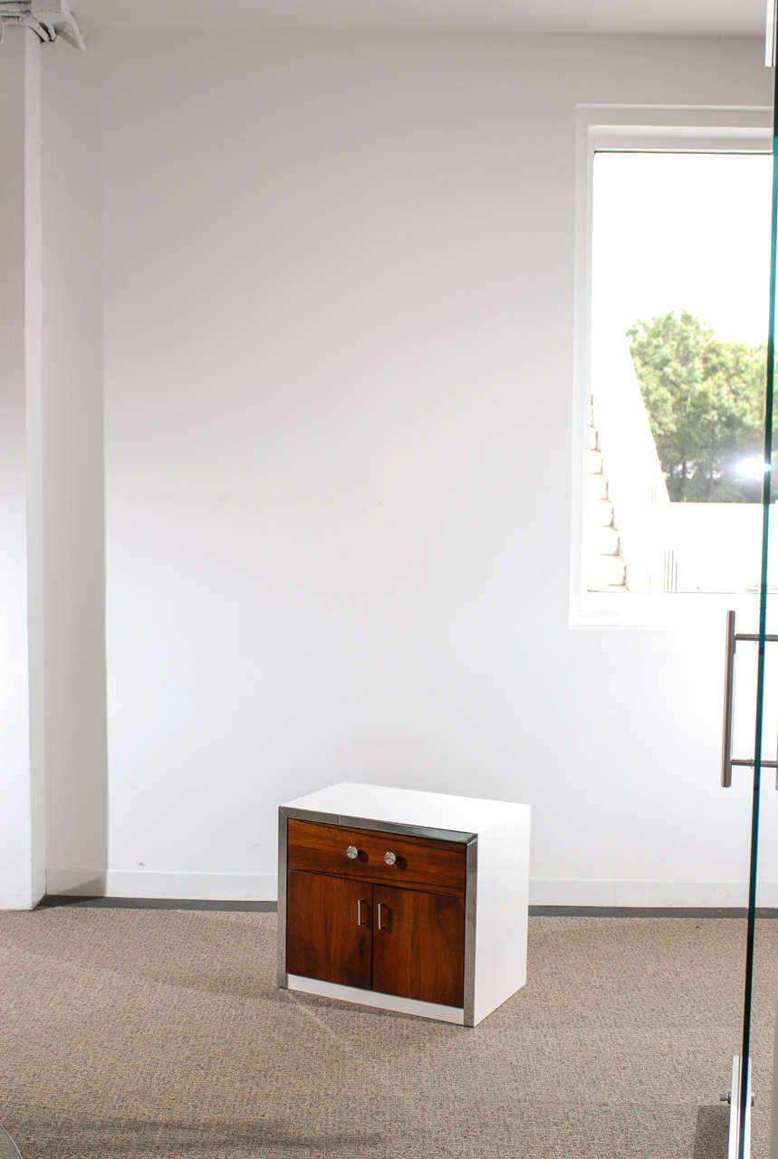 Great pair of end table/night stands from John Stuart, circa 1970. Solid rosewood drawer/door fronts with chrome accents. Excellent Vintage Condition. The price noted is for the pair.TOM ROBINSON MODERN at TRAVIS & COMPANY