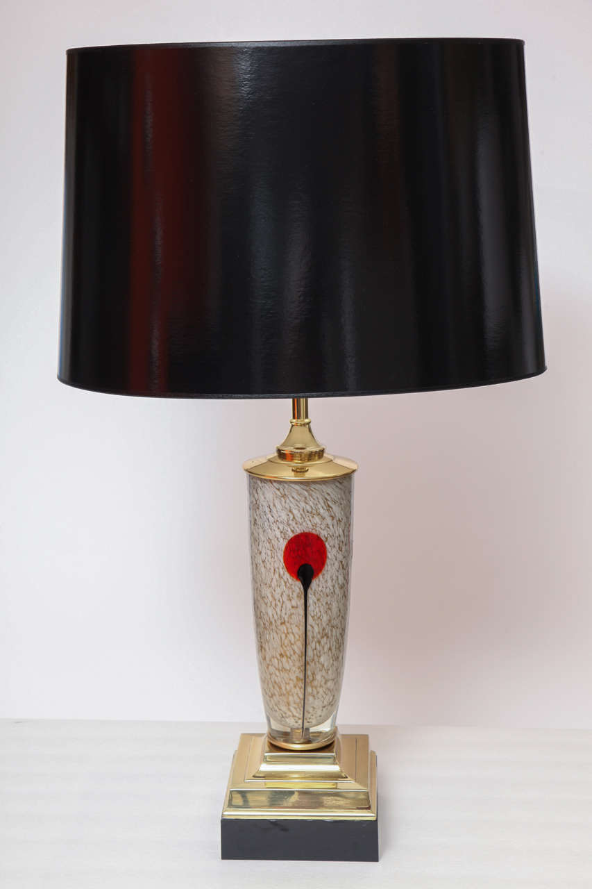 Decorative pair of Murano table lamps, Italy, circa 1950. The lamps have crystal bases with brass details.