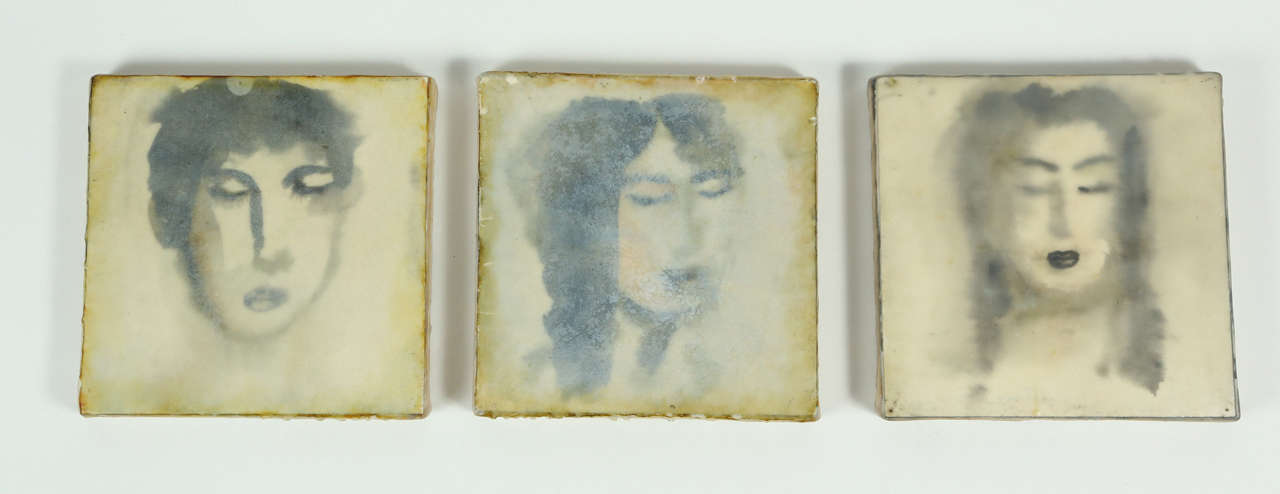 A haunting trio of encaustic portraits by Eric Blum, depicting two female subjects and one male. These encaustics are created by mixing layers of watercolor and beeswax on canvas that result in this dimensional artwork. Eric Blum is a NY-based