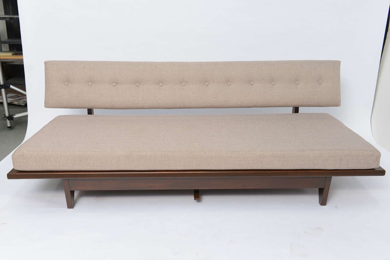 REDUCED FROM $5,500.
Designed in 1947 the Model 700 daybed sofa by Richard Stein for Knoll in walnut features elegant midcentury styling with expansive seat and tufted back. Center lever allows the back to recline, exposing the whole of the bottom