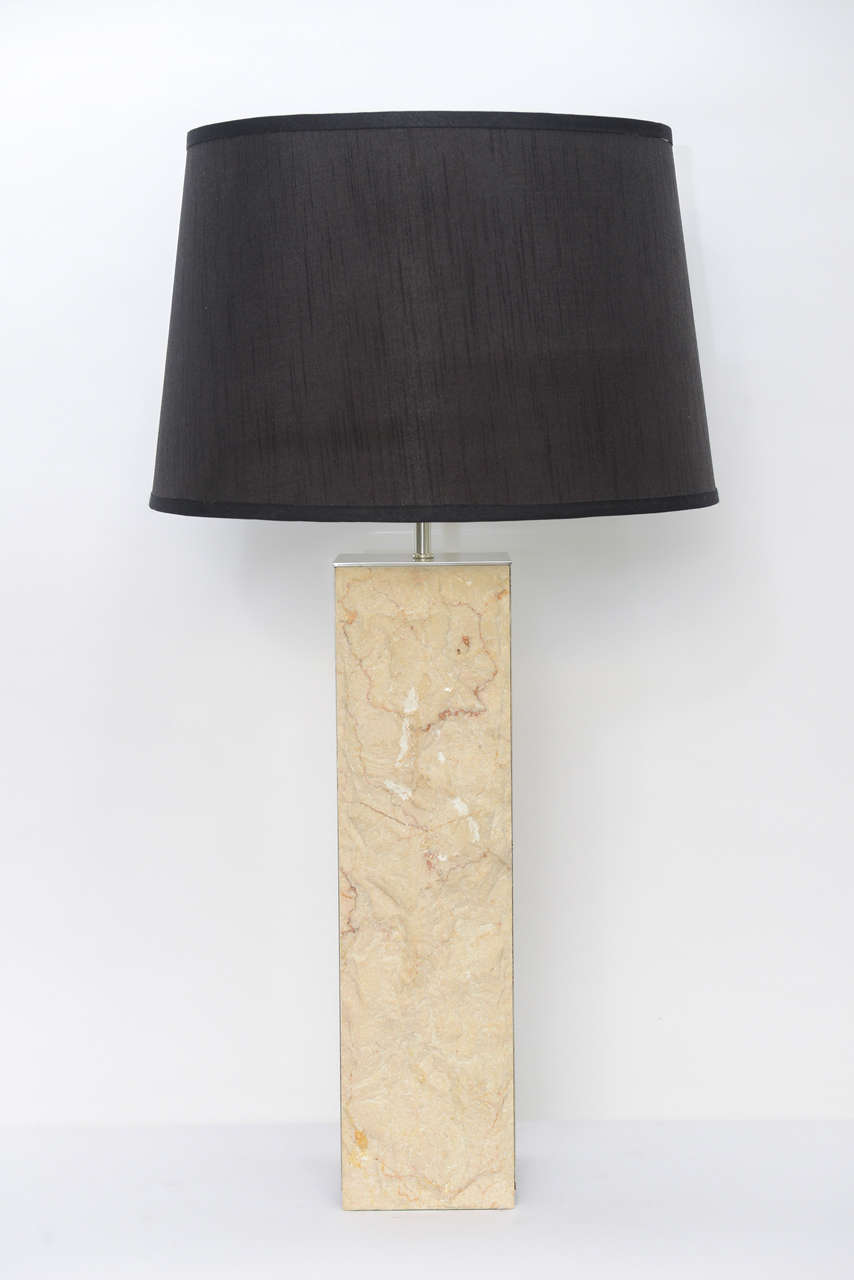 REDUCED FROM $1,750.
Exceptional, strong, modern and elegant, this table lamp features two sides of rough cut marble with polished aluminum on the opposing sides and top. Excellent original condition. Just add your shade. Shade shown as