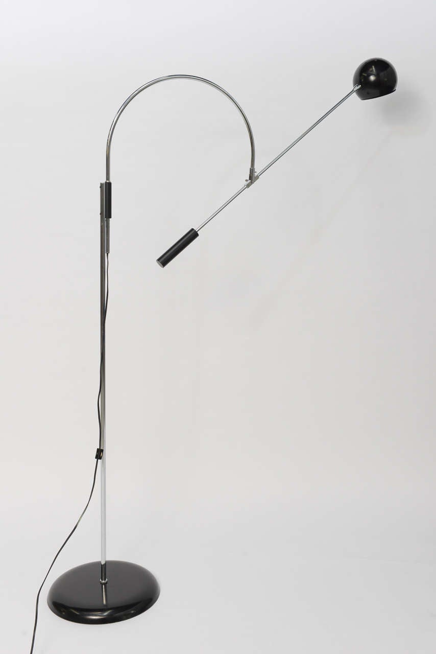 SOLD  Probably his most iconic lamp, Robert Sonneman's Orbiter floor lamp, here in original black and chrome.  With a wide range of movement and great reach, the perfect , modern elegant floor lamp. In excellent vintage condition, no issues.  Takes