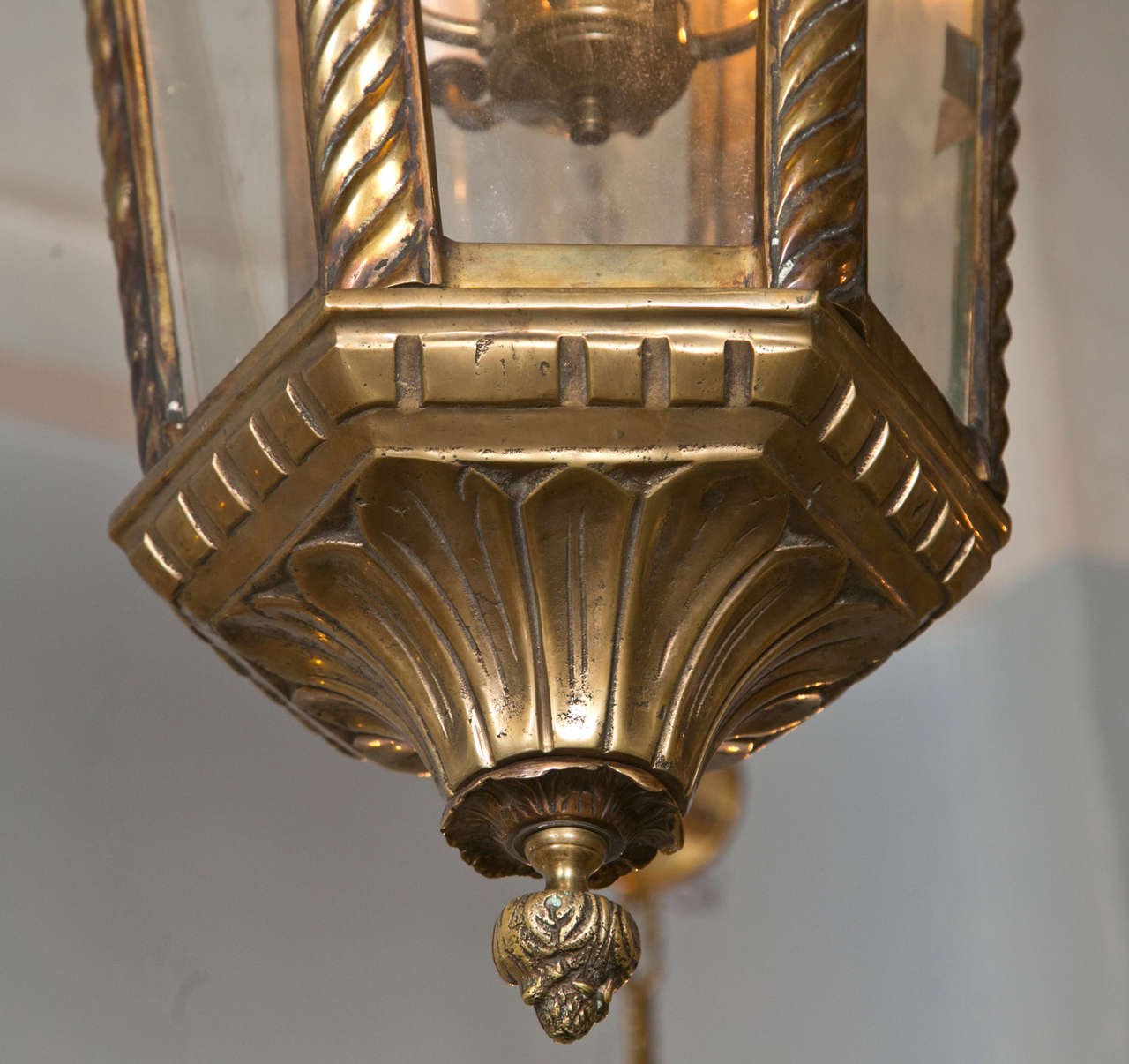Empire Style Bronze Lanterns or Chandeliers. A finely cast pair of chandeliers with each having four Angel heads over a all around glass sided hexagon. Each with four lights.