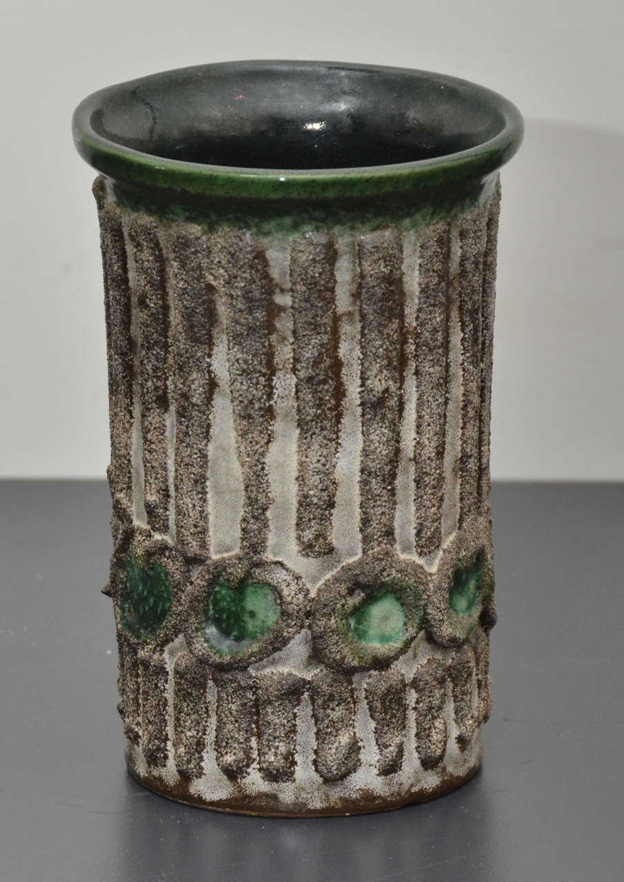 Green Vase with textured brown line and circle detail.