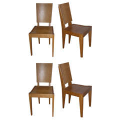 Set of 10 oak chairs by André Sornay