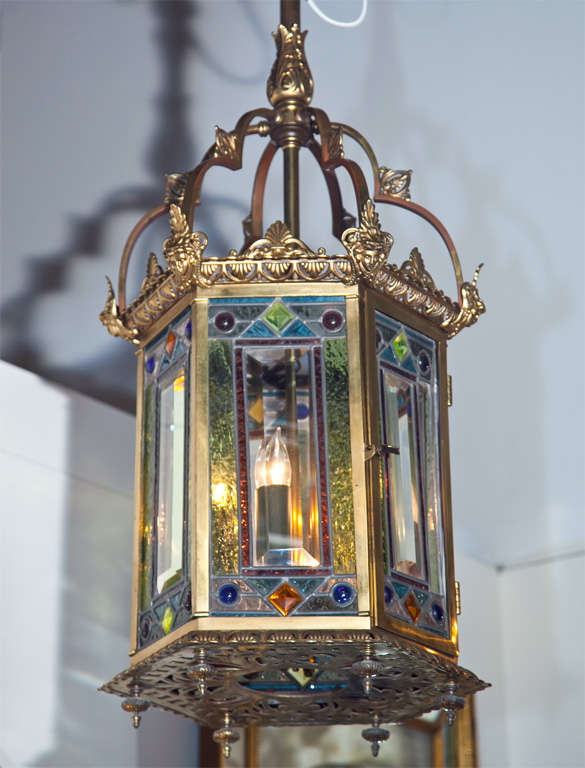 A wonderful six light bronze & multi color leaded glass and jeweled Aesthetic Movement hall lantern.