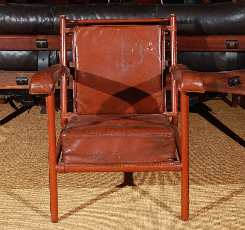 red leather & brass lounge chair