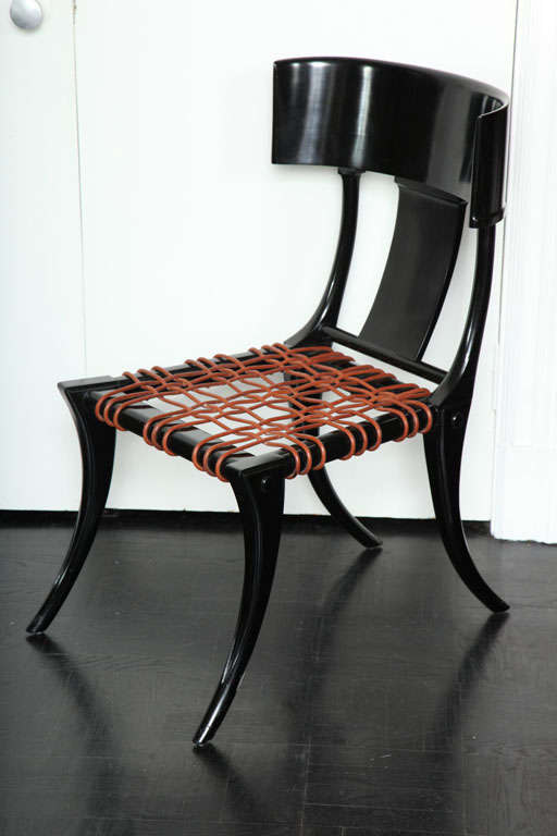 Made to order Klismos inspired ebonized side chair with leather webbed seat.