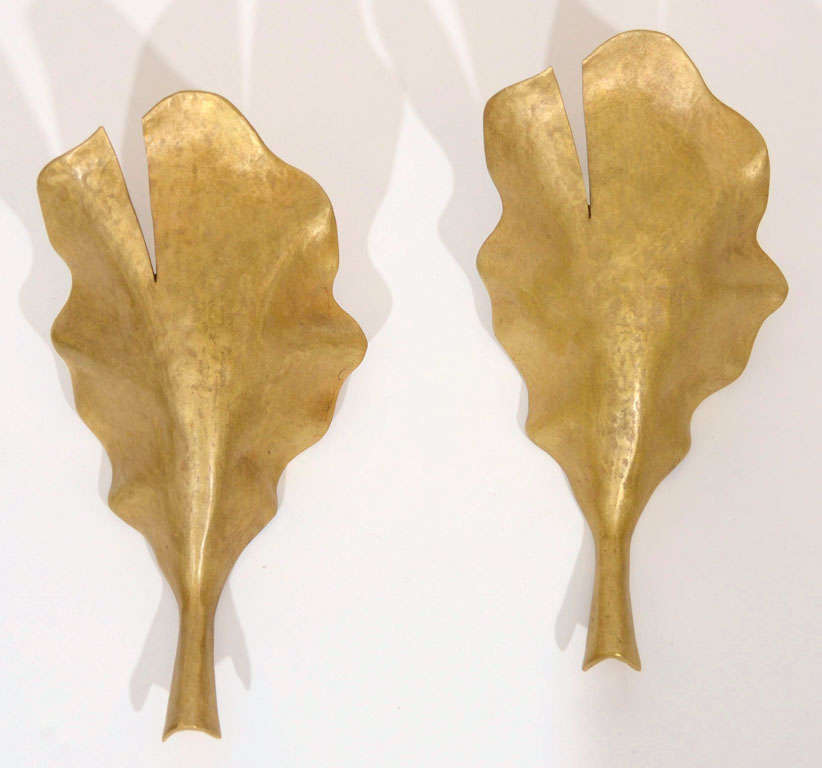 Contemporary patinated bronze sconces by Marc Bankowsky.

Bulb: One candelabra bulb
Wattage: 60 watts (maximum)

Please note, price is per sconce.