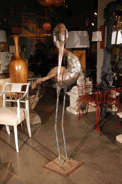 Very tall metal stork - heron sculpture.