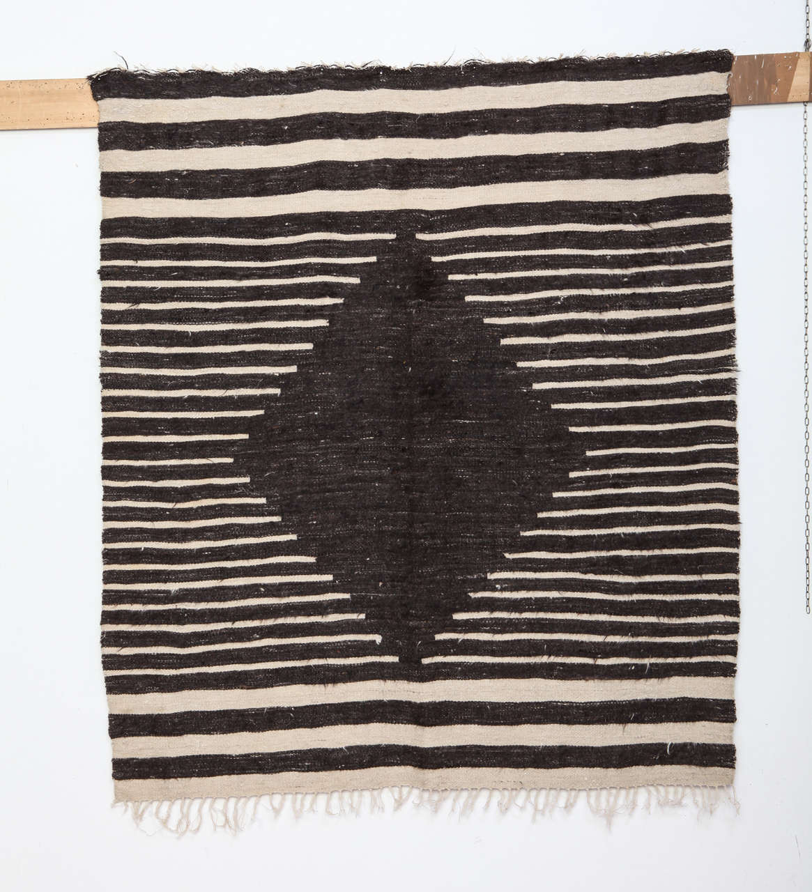 Woven in soft angora wool, flat-weaves such as this one are attributed to the eastern Anatolian village of Siirt, an area populated by Kurdish people. Typically in a small. Squarish format, they represent yet another example of the modern