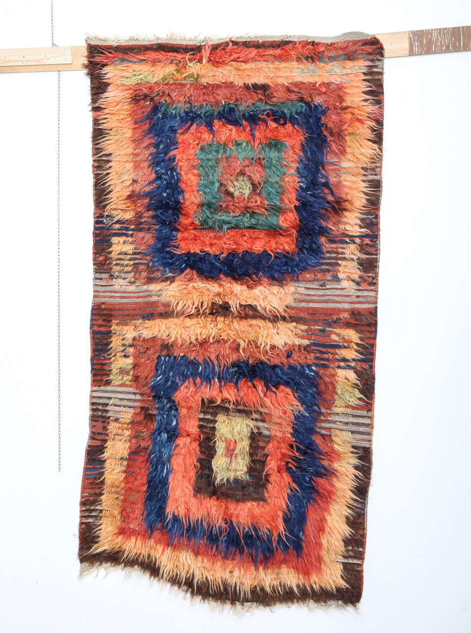 A rare and beautiful Tulu woven in two panels, each containing a series of concentric polychrome squares. The Kurdish Tulus are distinguished by a warp faced plain woven striped back in different colours embellished by extra weft brocading. Tulus of