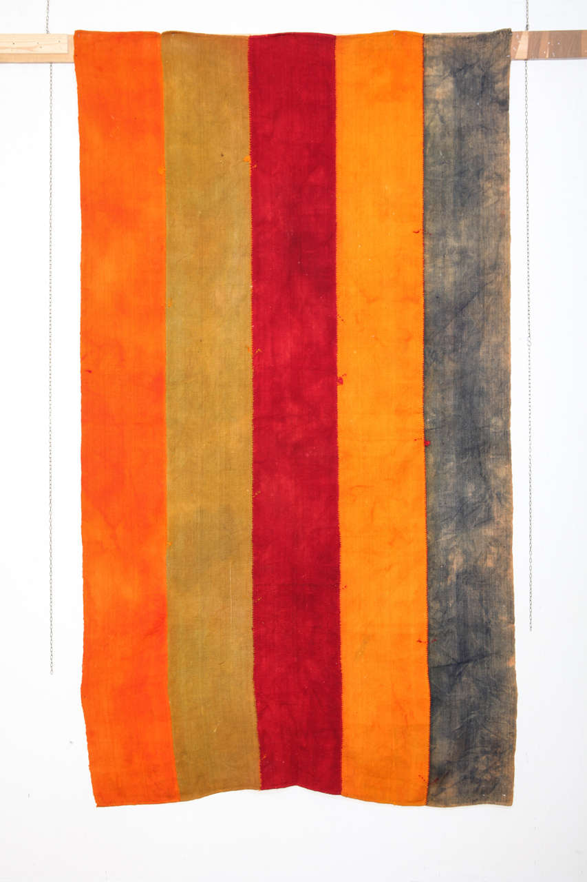 Perdehs were used as tent dividers by the Kurdish tribes of Eastern Anatolia. Each flat-woven wool panel is individually dip-dyed and subsequently hand-stitched to the other panels. The nature of dip-dyeing confers a painterly effect, as if each