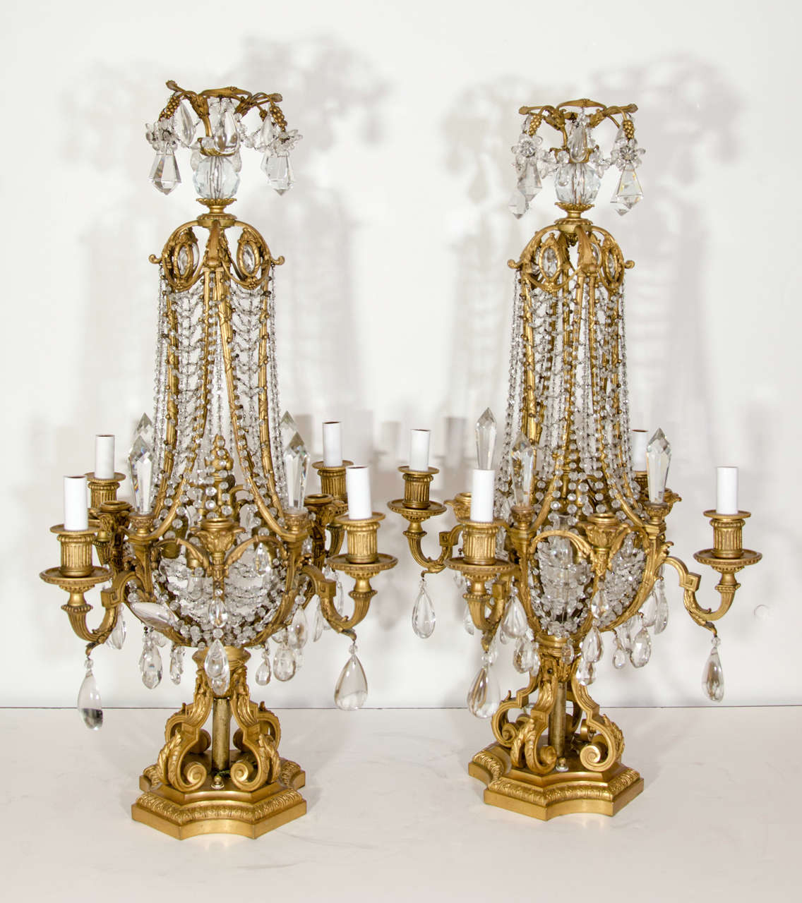 PR EXQUISITE & LARGE ANTIQUE FRENCH LOUIS XVI BACCARAT GILT BRONZE & CUT CRYSTAL MULTI LIGHT CANDELABRA/LAMPOS OF EXCEPTIONAL WORKMANSHIP EMBELLISHED WITH FINE LACE CRYSTAL CHAINS & FURTHER ADORNED WITH CUT CRYSTAL PRISMS, SIGNED BY BACCARAT, PARIS,