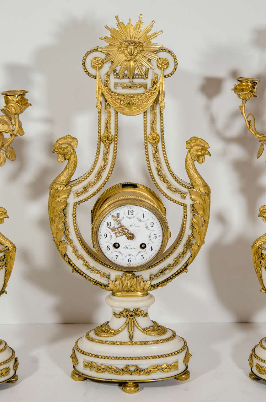 Hand-Carved Antique French Louis XVI Style Gilt Bronze and White Marble Lyre Form Clock Set For Sale