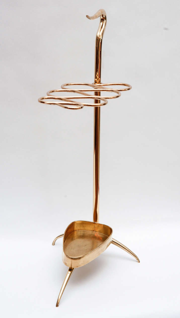 A chic handled Italian brass umbrella stand, this has all the earmarks of a Gio Ponti design, but we were unable to find any documentation.