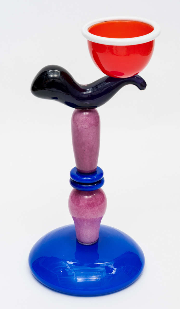 A Glass Murano object "Bold Soul Sister Bowl" by Peter Shire.
Multicoloured, opaque glass in colbalt blue, purple, red and white. Partly with powder meltings in rose. Different glass parts melted or glued.
Made by Vetreria Vistosi,